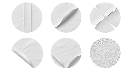 Six circular white paper stickers are displayed against a black background, each with a unique texture or condition. The stickers show variations such as folds, creases, peeling corners, torn edges, and a heavily crumpled surface, offering a range of visual effects for design purposes.の写真素材