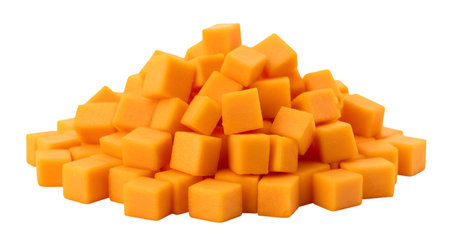 A mound of uniformly diced butternut squash cubes is piled high against a black background. The cubes are a bright, consistent orange color and show sharp edges, indicating they have been freshly cut. The pile is dense and textured, with individual cubes clearly visible. This image focuses on the prepared ingredient for cooking.の写真素材