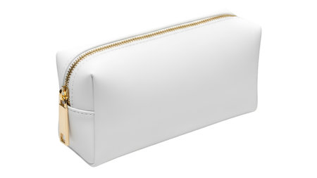 A clean, minimalist white cosmetic bag is presented in a studio shot against a black background. The bag features a smooth, slightly textured surface and is accented with a gleaming gold zipper and a matching gold zipper pull. Its simple, rectangular shape suggests functionality and elegance.の写真素材