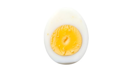 A close-up studio shot of a hard-boiled egg, perfectly halved. The bright yellow yolk is centered...