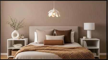 Serene modern minimalist bedroom with soft lighting and cozy beddingの写真素材
