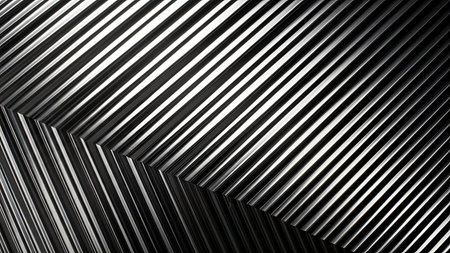 An abstract pattern composed of parallel metallic ribs creating a ribbed texture. The lines are sharp and precise, forming geometric shapes with distinct angles and planes. The interplay of light and shadow accentuates the metallic sheen and the depth of the ribbed structure.の写真素材