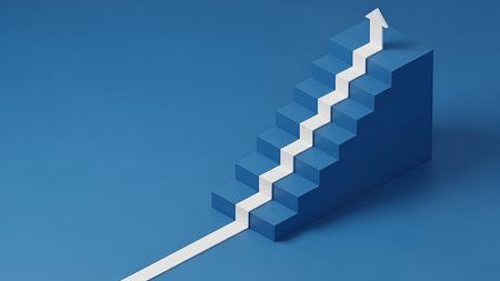 A minimalist 3D render of a blue staircase against a solid blue background. A prominent white arrow, shaped like a graph line, ascends along the steps, indicating progress, growth, or success. The image conveys a clear message of advancement and achievement through a simple, symbolic representation.の写真素材