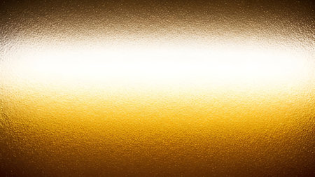 A horizontal golden metallic surface with a diffused, bright white light band across the center. The...