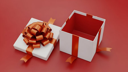 A white gift box with an orange ribbon and a large, textured orange bow is shown open against a red...