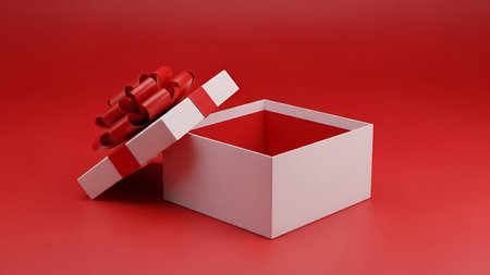 An open white gift box with a prominent red ribbon and bow is positioned on a vibrant red...