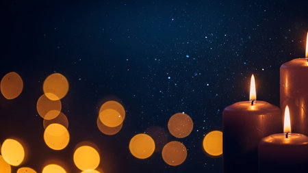 The two lit candles with glowing flames against a dark, starry night sky. The background is filled with soft, warm bokeh lights in yellow and orange hues, creating a serene and peaceful atmosphere. The contrast between the lit candles and the dark sky adds a sense of calm and tranquility to the scene.の写真素材