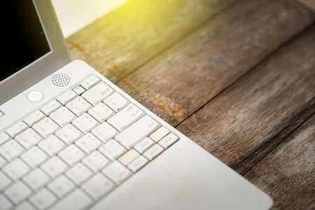 Close up Key board on wooden tableの写真素材
