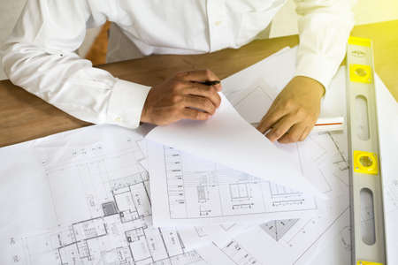 architect point at blueprint, architectural concept