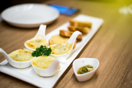 Cheese shell on the table is very good. The gesture is delicious and the fish sauce is chili sauce.の写真素材