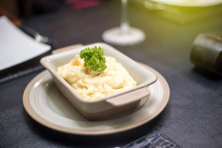 The mashed potatoes in the bowl are very delicious to eat.の写真素材