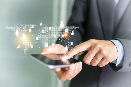 Businessman hand phone with virtual social media buttons conceptの写真素材