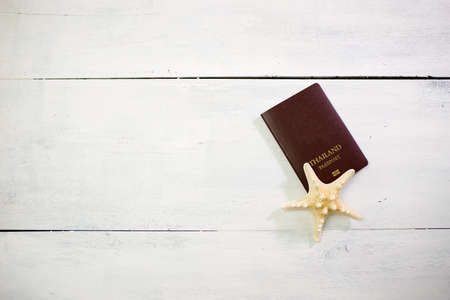 Planning travel concept, passport on white wood tableの写真素材
