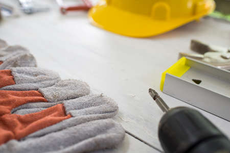 Construction safety equipment on wood tableの写真素材