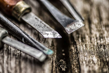 Old used wood chisels selection on the wooden table,High Dynamic Range tone