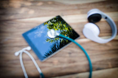 Tree mirrors with tablet and Stethoscope, Headphones blur top view