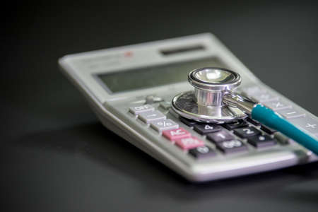 Finance accounting Medical treatment ,Stethoscope and calculatorの写真素材