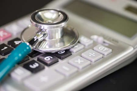 Finance accounting Medical treatment ,Stethoscope and calculatorの写真素材