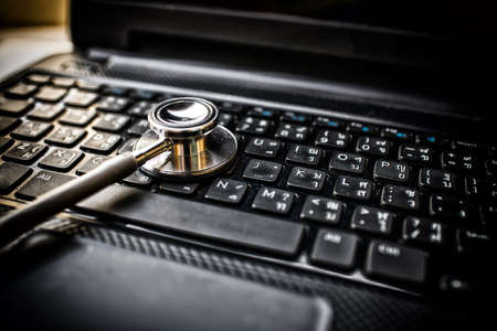 Selective focus Stethoscope on laptop keyboard - health care and medical High Dynamic Range tone conceptの写真素材