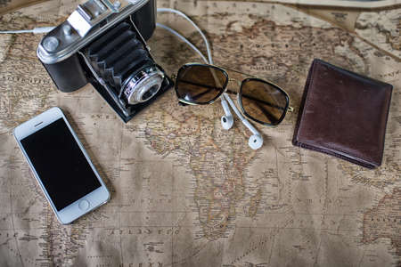 Accessories for travel,wallet,photo camera, smart phone,sunglass,smalltalk and travel map High Dynamic Range tone.の写真素材