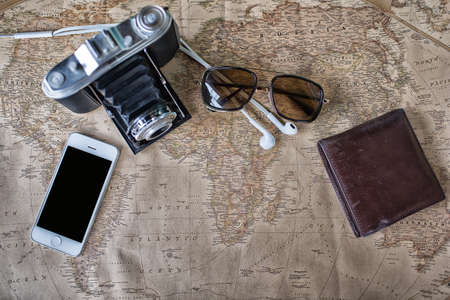 Accessories for travel,wallet,photo camera, smart phone,sunglass,smalltalk and travel map High Dynamic Range tone.の写真素材