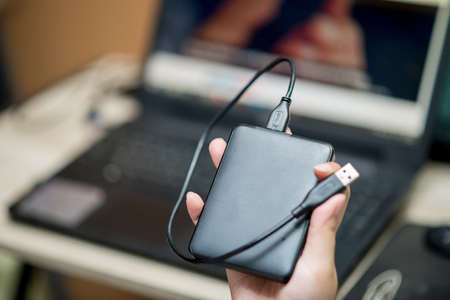 External hard drive for backup in handの写真素材