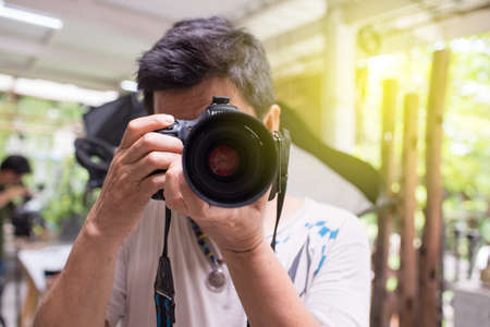 Photographer taking pictures with digital cameraの写真素材