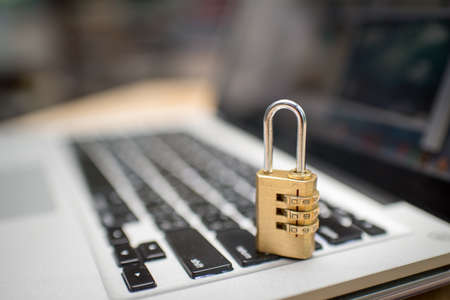 Cyber safety concept, locked and key on laptop computer keyboardの写真素材