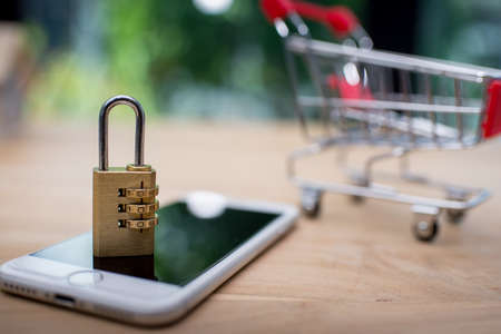 Smartphone with an locked lock on it. Mobile phone security and data protection concept and save shopingの写真素材
