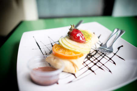 Crape cake in dish on the tableの写真素材