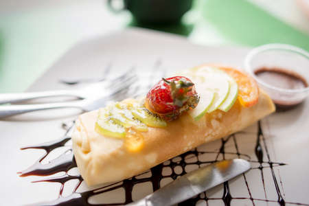 Crape cake in dish on the tableの写真素材