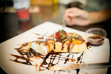 Crape cake in dish on the tableの写真素材