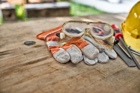 Standard construction safety equipment on wooden table. top view High Dynamic Range toneの写真素材
