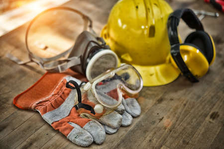 Standard construction safety equipment on wooden table. top view High Dynamic Range toneの写真素材