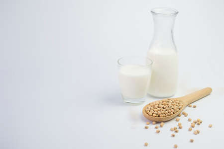 Isolated soy beans and soy milk in a glass