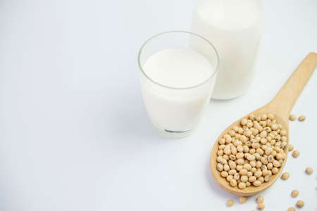 Milk with soy beans on white backgroundの写真素材