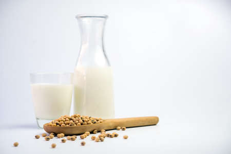 Isolated soy beans and soy milk in a glassの写真素材