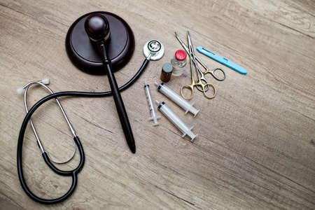 medical law and a judge gavel on desk in the library. concept of legal education.Top viewの写真素材