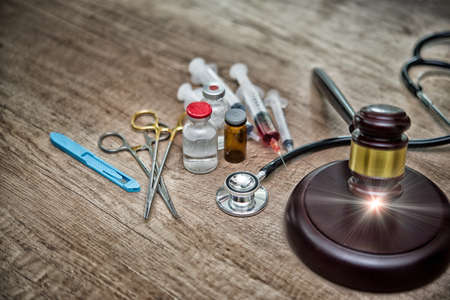 medical law and a judge gavel on desk in the library. concept of legal education.Top view,High Dynamic Range toneの写真素材