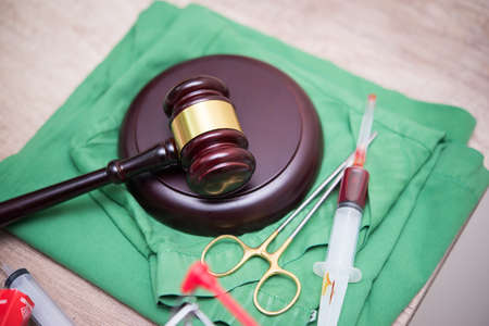 Gavel and stethoscope. medical jurisprudence. legal definition of medical malpractice. attorney. common errors doctorsの写真素材