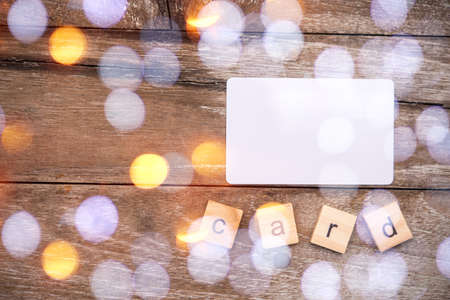Business card on wood table,bokeh foregroundの写真素材