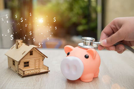 Real estate or home savings - piggy bank,business conceptの写真素材