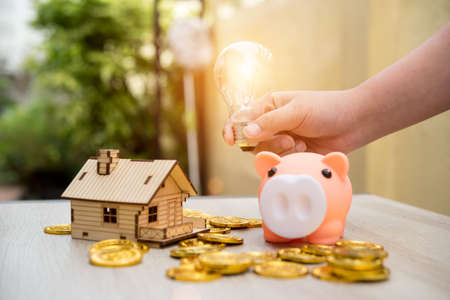 Real estate or home savings - piggy bank,business conceptの写真素材