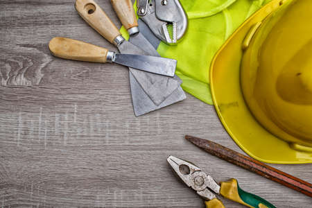 Standard construction safety equipment on wooden table. top view High Dynamic Range toneの写真素材