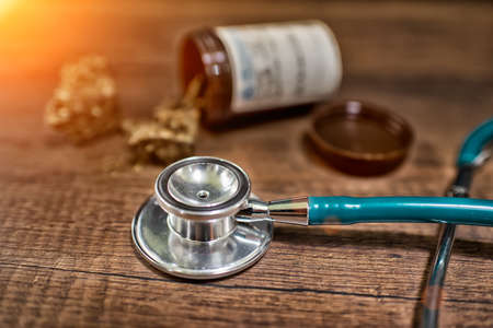 stethoscope and Cannabis used for healing on wooden background,High Dynamic Range toneの写真素材
