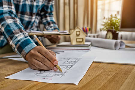 man working of Architect sketching a construction project,High Dynamic Range tone