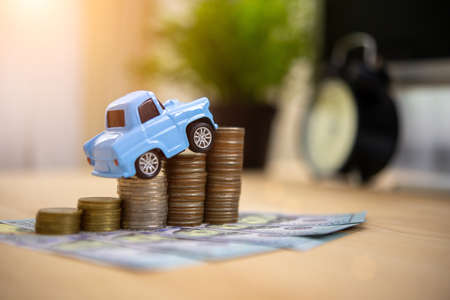 Collect money to buy cars in the future Saving money conceptのeditorial素材