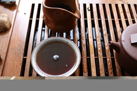 Chinese tea ceremony using tea utensils made of glass and porcelain.の写真素材