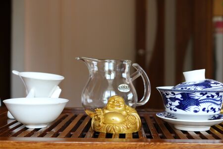 Chinese tea ceremony using tea utensils made of glass, clay and porcelain.