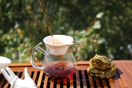 Chinese tea ceremony using tea utensils in nature.の写真素材